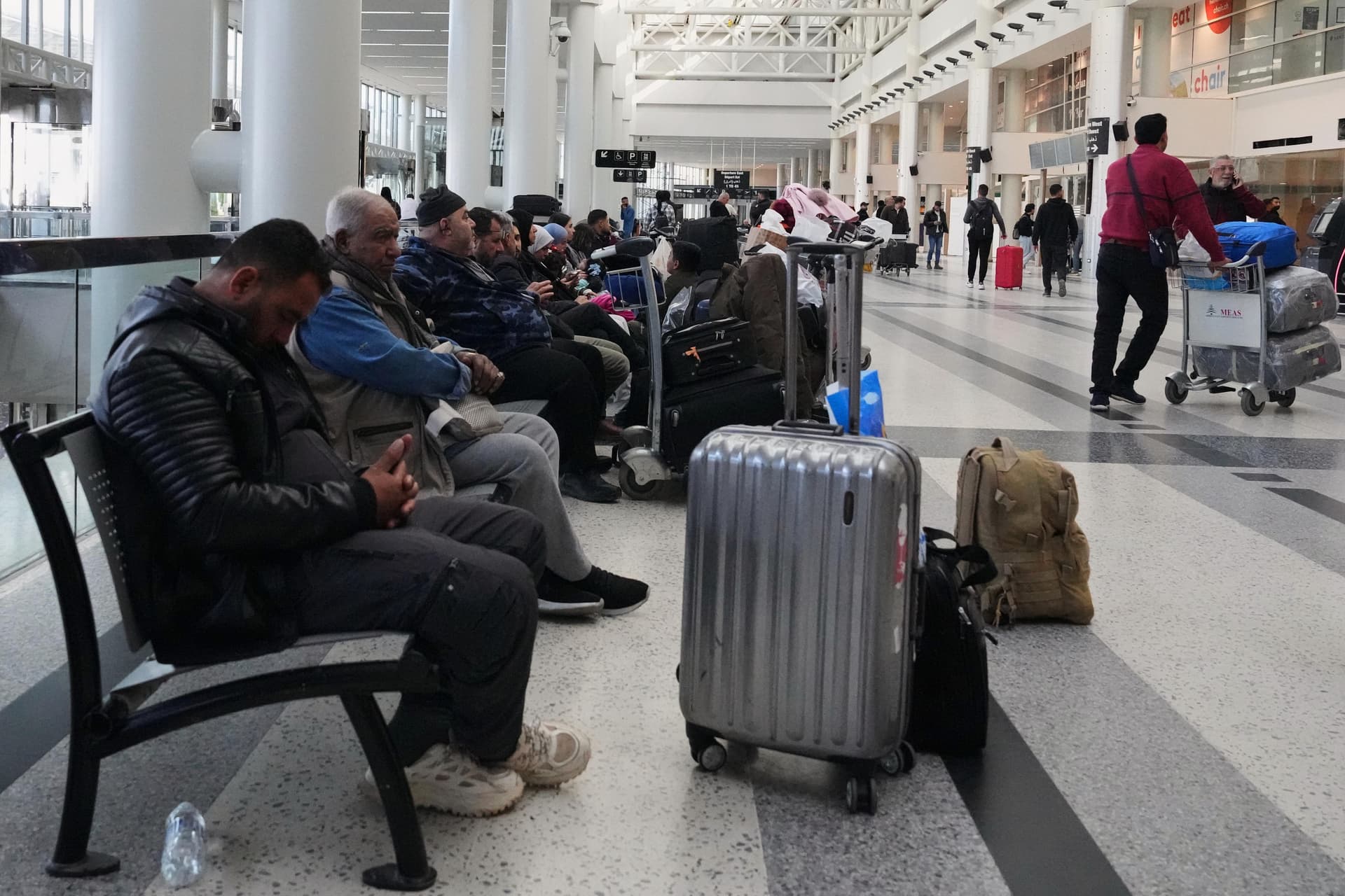 Stranded travelers scramble to make new connections as war shuts much of Middle East to air travel