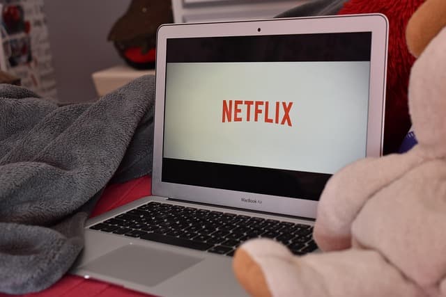 Why did Netflix back down from its deal to acquire Warner Bros.?